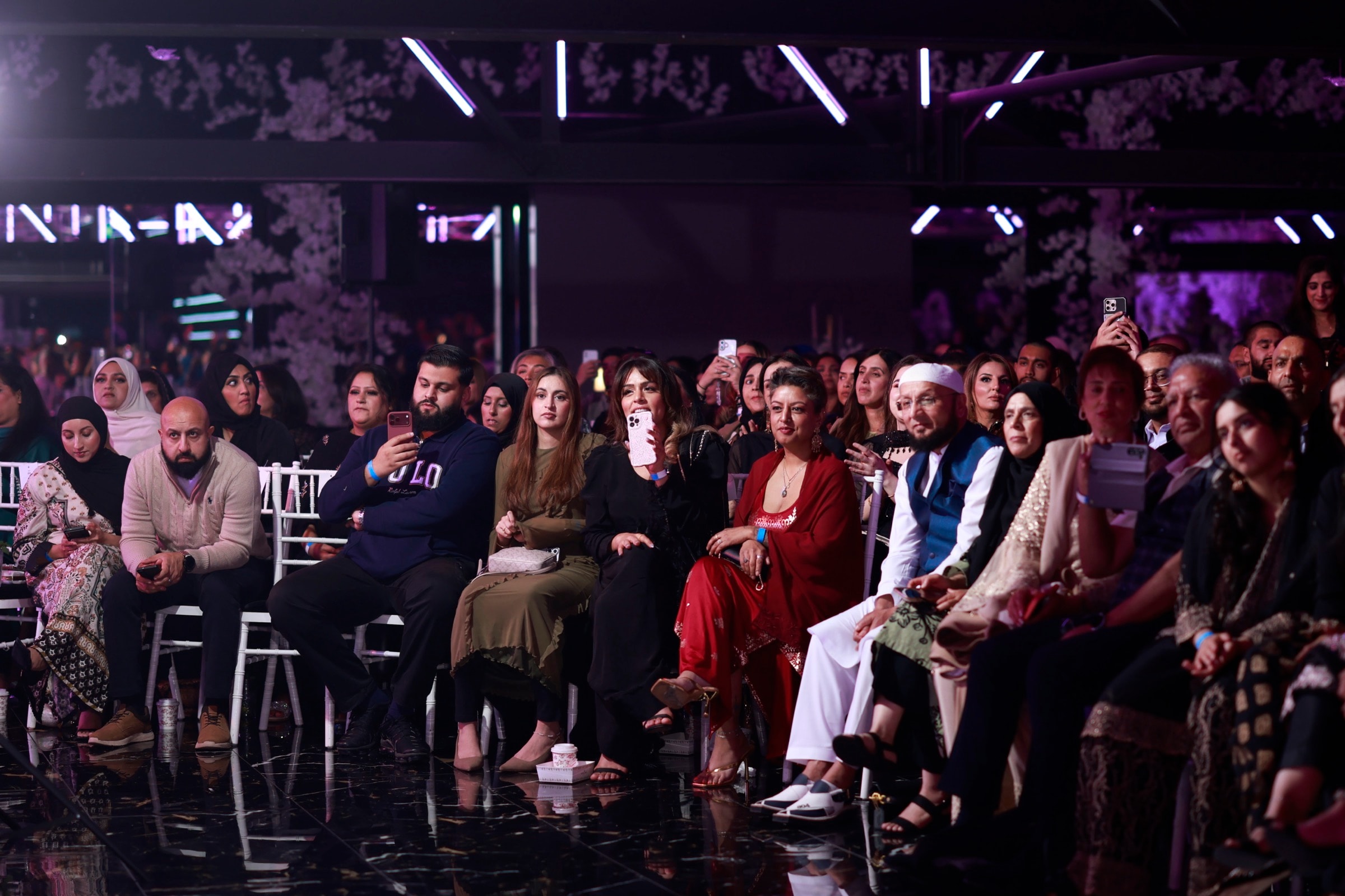 The audience watching a show at Excellency