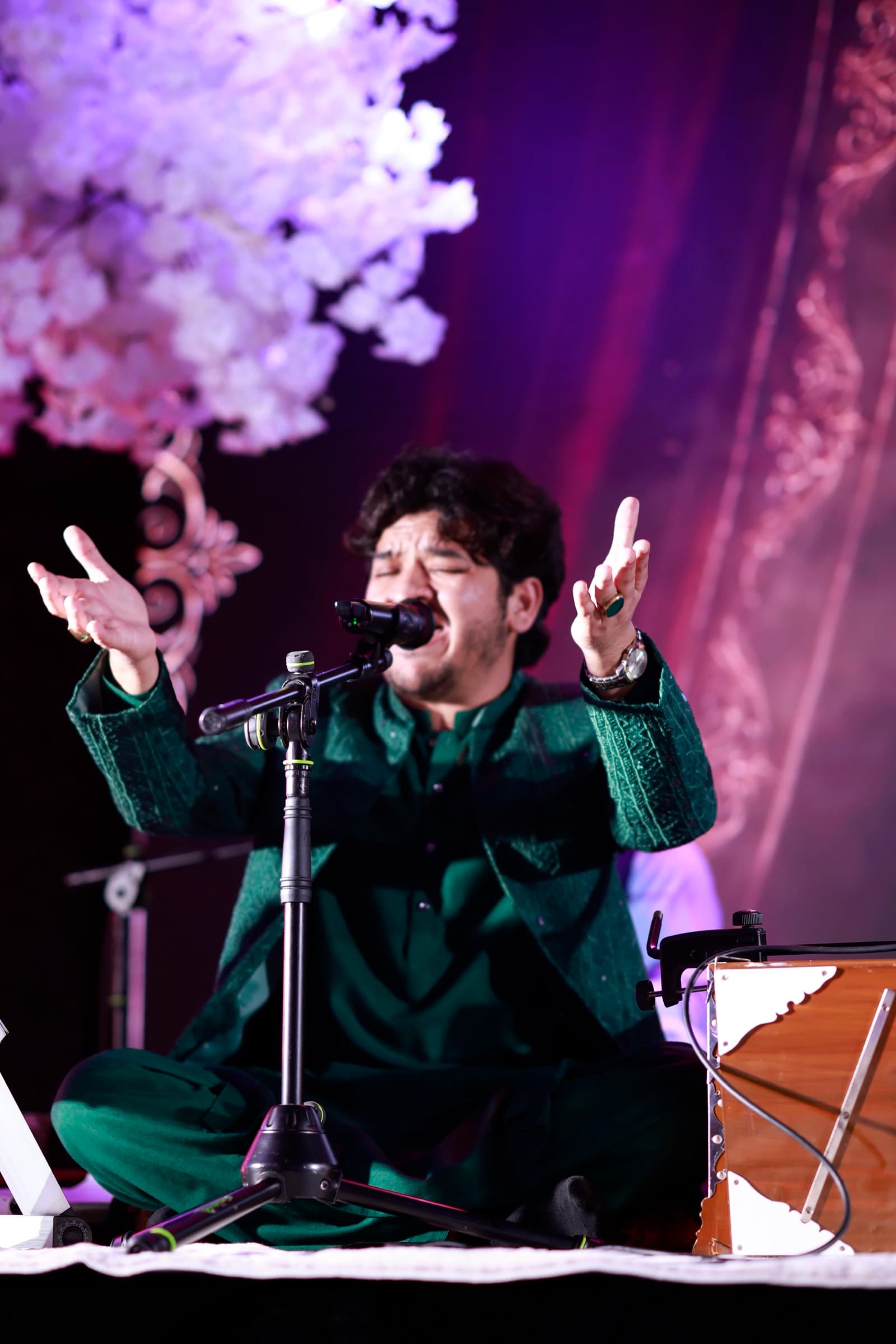 Qawwal singer mid-performance on the Excellency stage